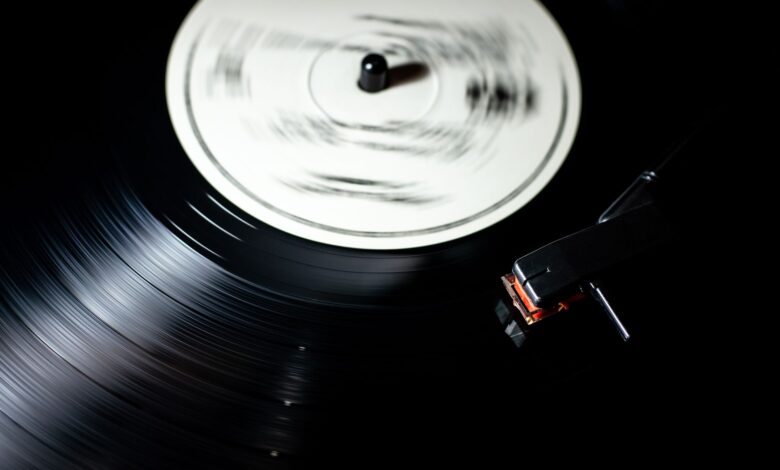 Close-up of a vintage vinyl record spinning on a turntable.