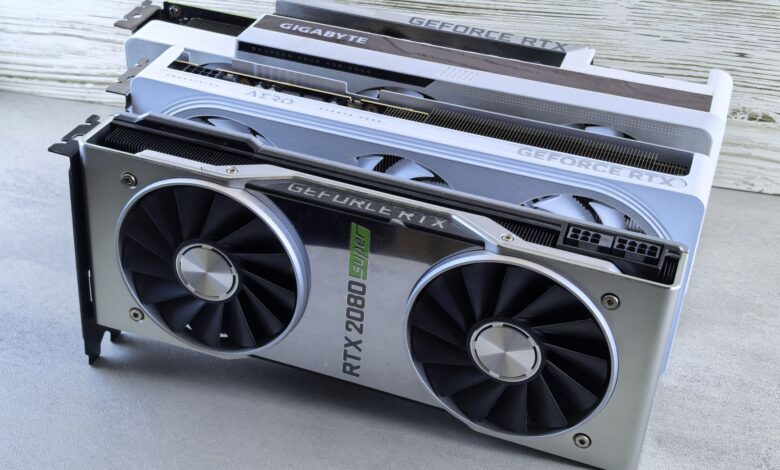 Three NVIDIA GeForce RTX graphics cards stacked on a surface, showcasing their sleek design and branding details.