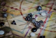 A vibrant board game scene featuring dice and a colorful map layout.