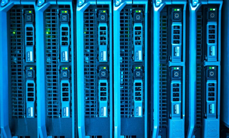 Detailed image of illuminated server racks showcasing modern technology infrastructure.