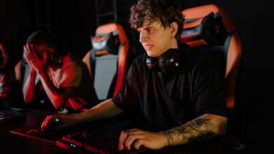 Focused gamers competing in a high-stakes eSports tournament with gaming chairs and headsets.