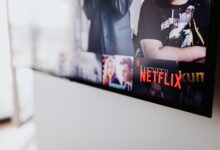 Selective focus of a Netflix screen on a smart TV in an indoor setting.
