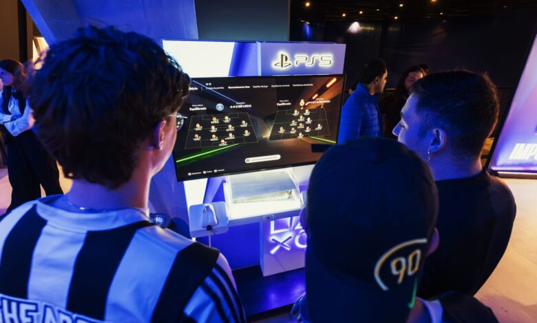 Group of gamers engaged in a PS5 event, choosing teams on a football game selection screen.
