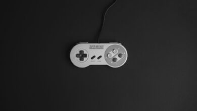 Super Nintendo game controller on a black background, vintage gaming theme.