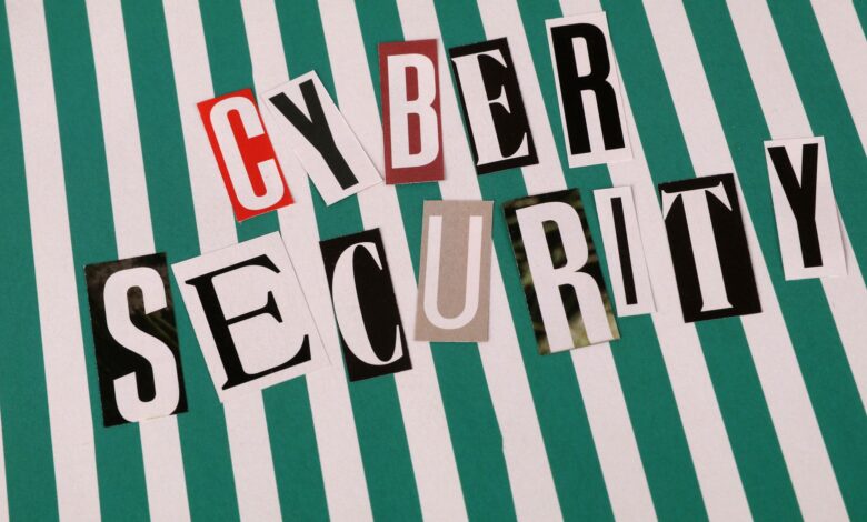 Cyber security concept depicted with a creative text collage on striped background.