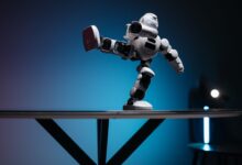 A modern robot toy balancing dynamically on one leg, set against a blue gradient background.