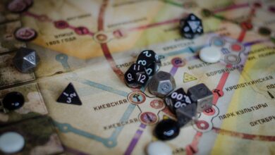 A vibrant board game scene featuring dice and a colorful map layout.