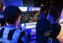 Group of gamers engaged in a PS5 event, choosing teams on a football game selection screen.