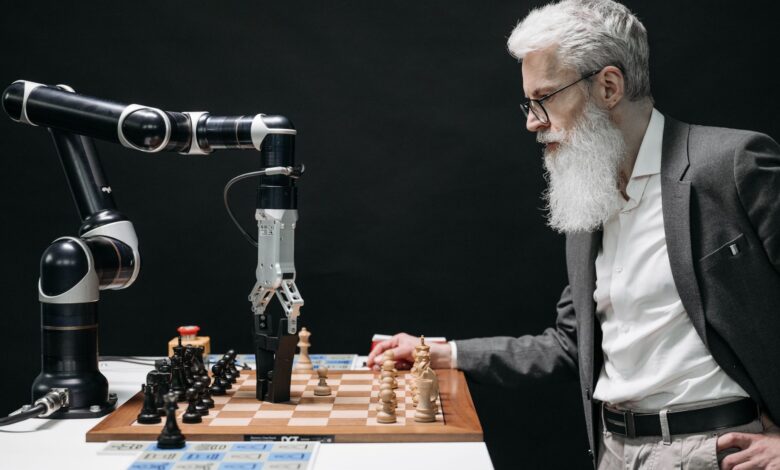 A man plays chess against an AI robotic arm, showcasing technology and strategy innovation.