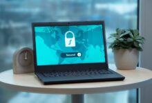 Laptop displaying a security lock icon on a table with a potted plant and clock.