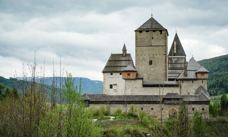 Majestic view of Mauterndorf Castle surrounded by lush greenery in Salzburg, Austria.