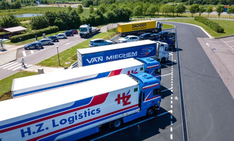 Aerial image showcasing logistics trucks parked in a rest area.