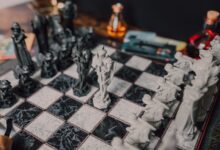 Intricate medieval themed chess set displayed on a marble chessboard. Perfect for strategy enthusiasts.