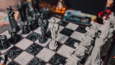 Intricate medieval themed chess set displayed on a marble chessboard. Perfect for strategy enthusiasts.