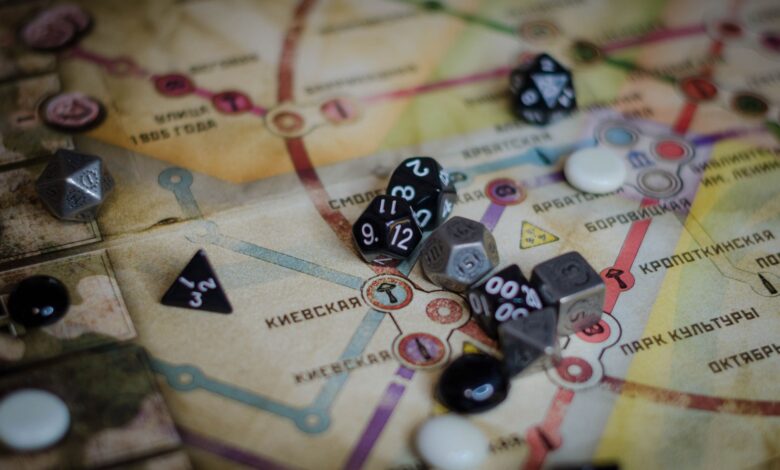 A vibrant board game scene featuring dice and a colorful map layout.