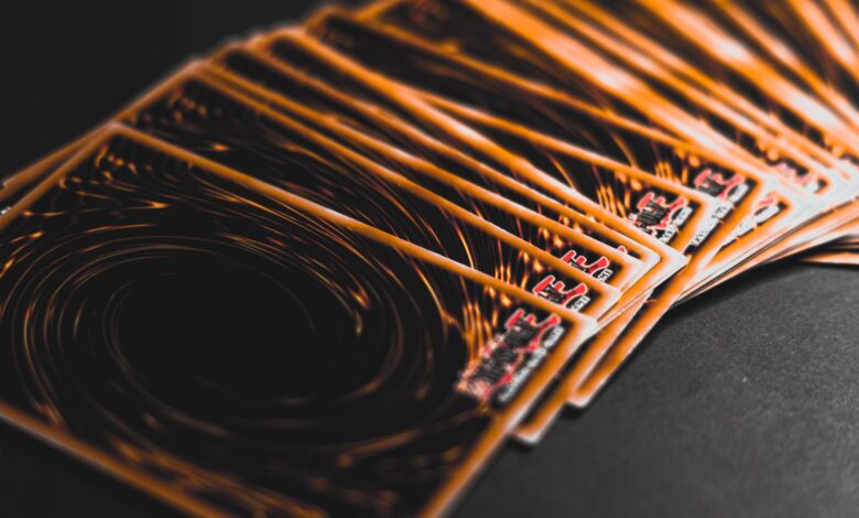 Close-up view of collectible trading cards in a fan arrangement, highlighting intricate patterns.