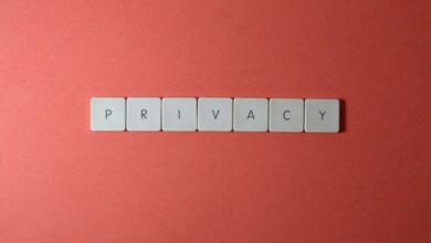 Close-up of letter tiles spelling PRIVACY on a red background, symbolizing data protection.
