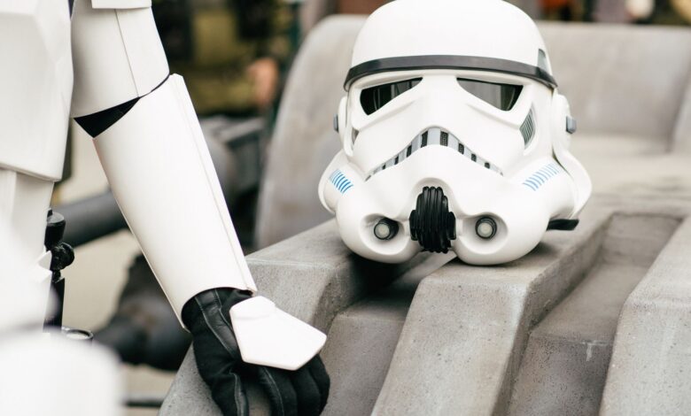 Detailed shot of a stormtrooper helmet and costume in a cosplay event, showcasing sci-fi culture.