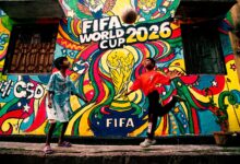 Vibrant mural of FIFA World Cup 2026 with kids playing soccer in the foreground.
