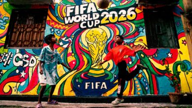 Vibrant mural of FIFA World Cup 2026 with kids playing soccer in the foreground.