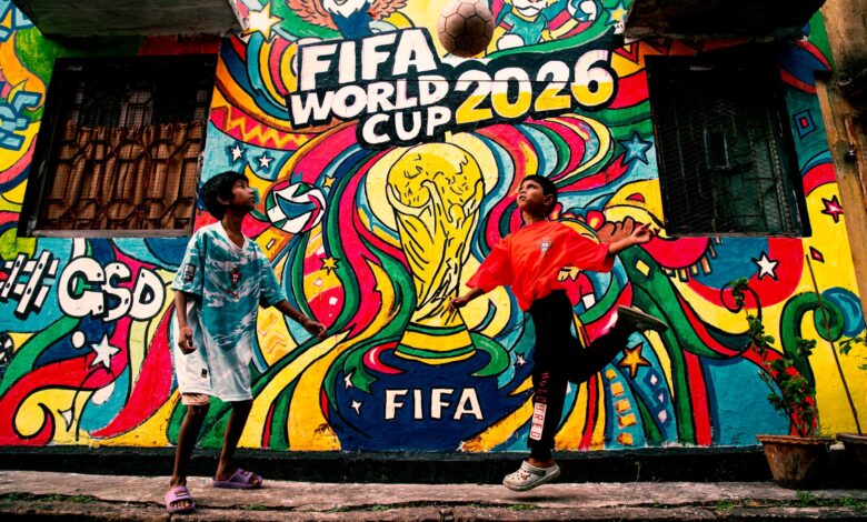 Vibrant mural of FIFA World Cup 2026 with kids playing soccer in the foreground.