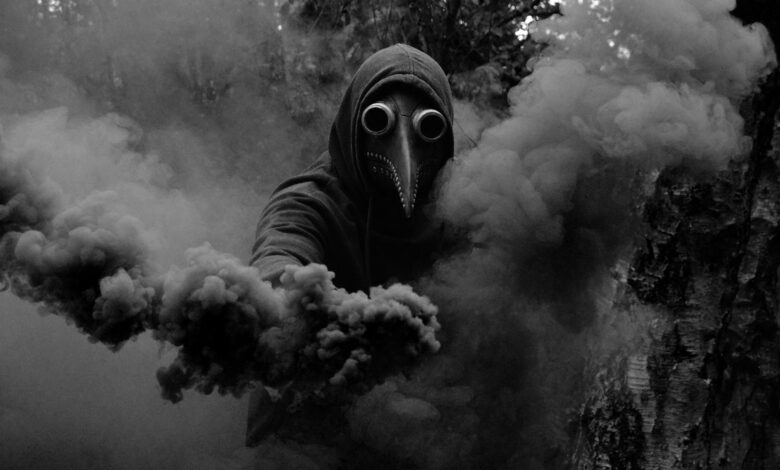 A haunting figure wearing a plague doctor mask enveloped in dark swirling smoke, creating an eerie and atmospheric scene.