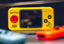 Colorful close-up of a Pac-Man themed My Arcade Pocket Player. Perfect for retro gaming enthusiasts.