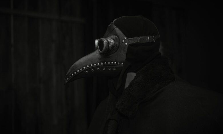A haunting still life of a plague doctor mask in dark lighting, evoking historical and gothic themes.