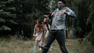 Terrifying zombies stumbling through a dark, creepy forest setting, perfect for horror themes.