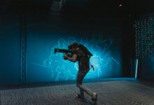 A person engages in immersive virtual reality gaming with VR gear indoors.