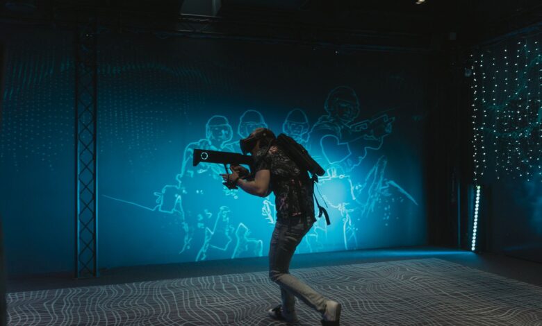A person engages in immersive virtual reality gaming with VR gear indoors.