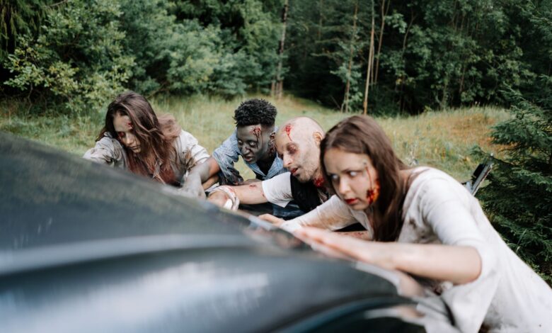 A group of zombies attack a car in a dense forest, creating a chilling, horror-filled scene.