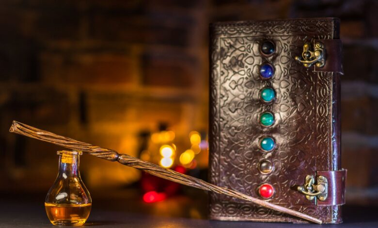 Close-up of a wizard's wand and potion with a magical spell book on a rustic background.