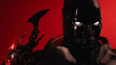 Dramatic portrayal of Batman cosplay against a vivid red backdrop, emphasizing iconic details.