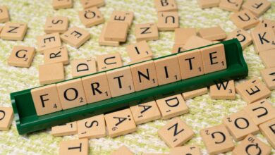 Scrabble tiles forming the word Fortnite, symbolizing gaming creativity and fan art.