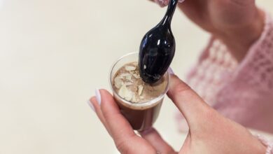 Elegant dessert in a cup with almonds, perfect for gourmet presentations.