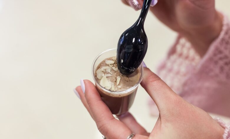 Elegant dessert in a cup with almonds, perfect for gourmet presentations.