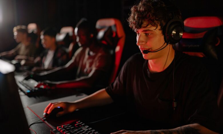 A dedicated team of young gamers engaging in a competitive esports tournament.