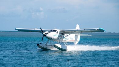 Seaplane gracefully landing on turquoise ocean waters in Key West, Florida.