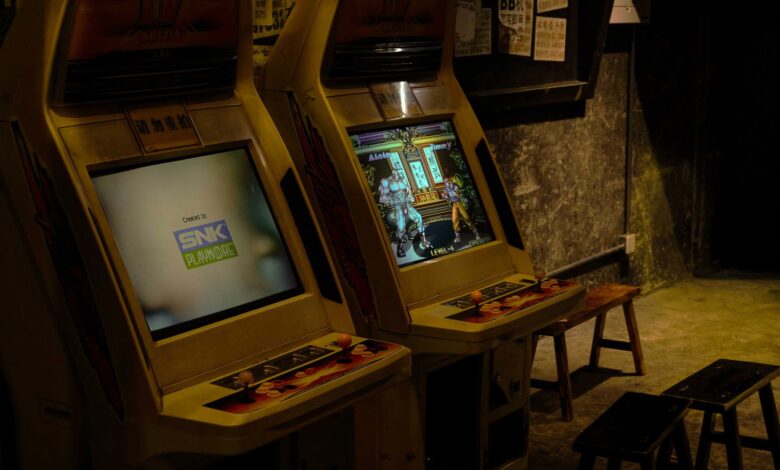Explore retro arcade machines in a dimly lit gaming area in Changsha, China, capturing nostalgic vibes.