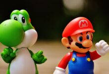 Detailed close-up of Mario and Yoshi figurines from a popular video game franchise.