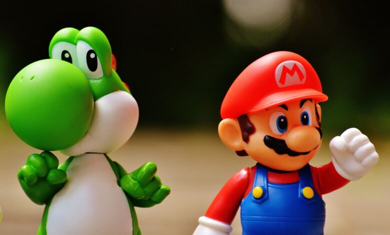 Detailed close-up of Mario and Yoshi figurines from a popular video game franchise.