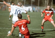 Dynamic soccer match photo showcasing intense gameplay and teamwork on the field.