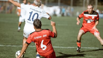 Dynamic soccer match photo showcasing intense gameplay and teamwork on the field.