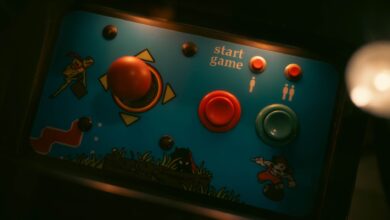 Close-up of retro arcade game controls with joystick and buttons
