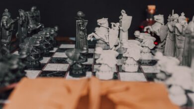 Detailed close-up of a medieval themed chess set highlighting strategy and artistry in black and white.