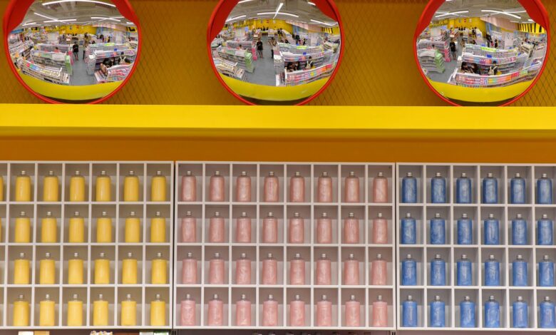 Vibrant warehouse scene with colorful shelves and circular mirrors, capturing a busy shopping environment.