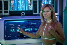 A woman interacts with a futuristic touchscreen display in a technology-themed environment.
