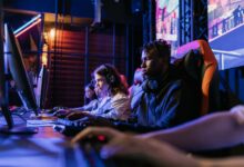 Serious gamers engage in a competitive esports event, highlighting focus and teamwork.