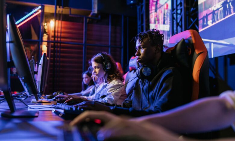 Serious gamers engage in a competitive esports event, highlighting focus and teamwork.